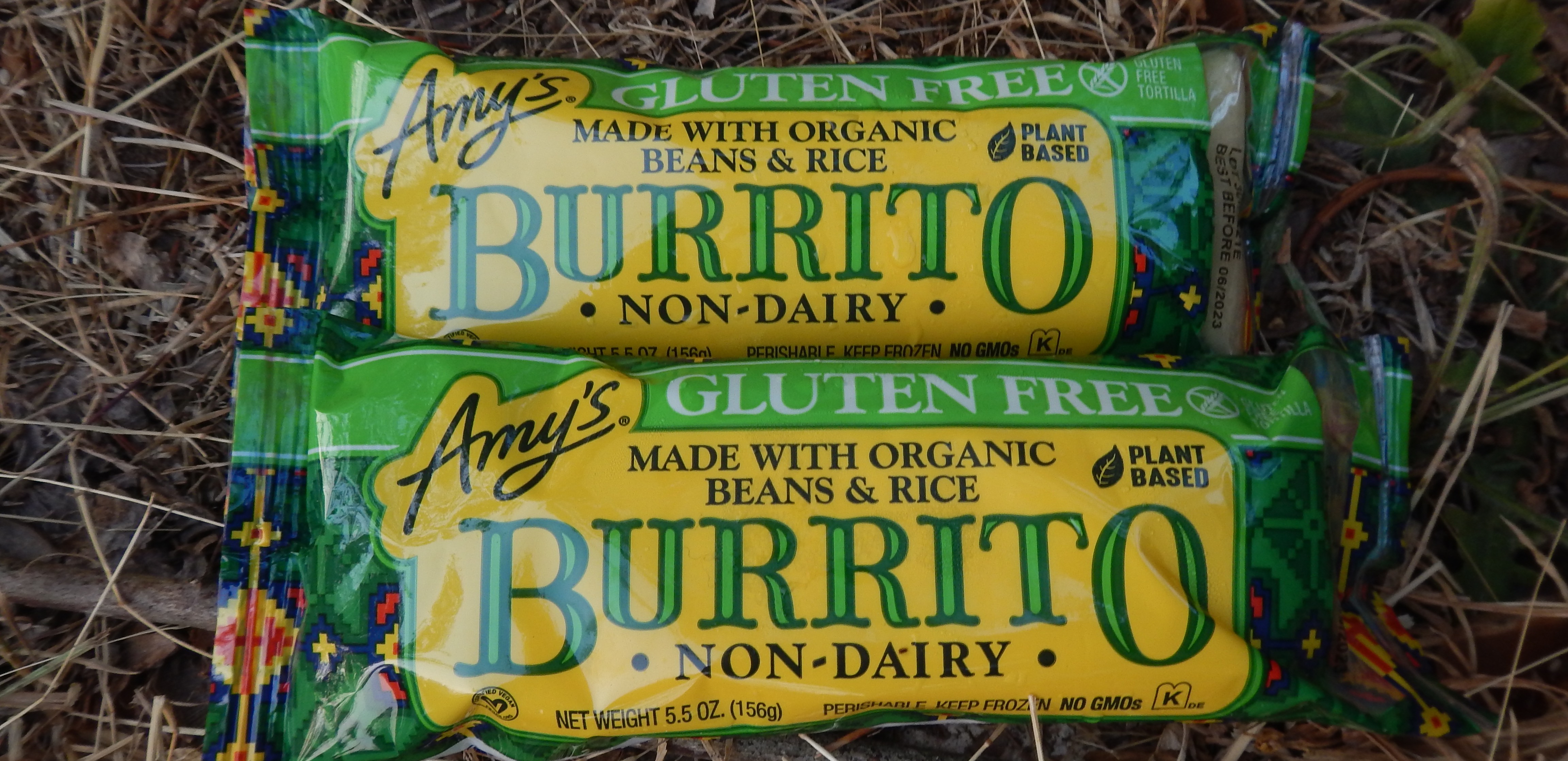 Two frozen burritos in Amy's Kitchen packaging