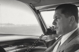 The late Teamsters president Jimmy Hoffa talking on the phone in a car.