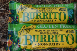 Two frozen burritos in Amy's Kitchen packaging