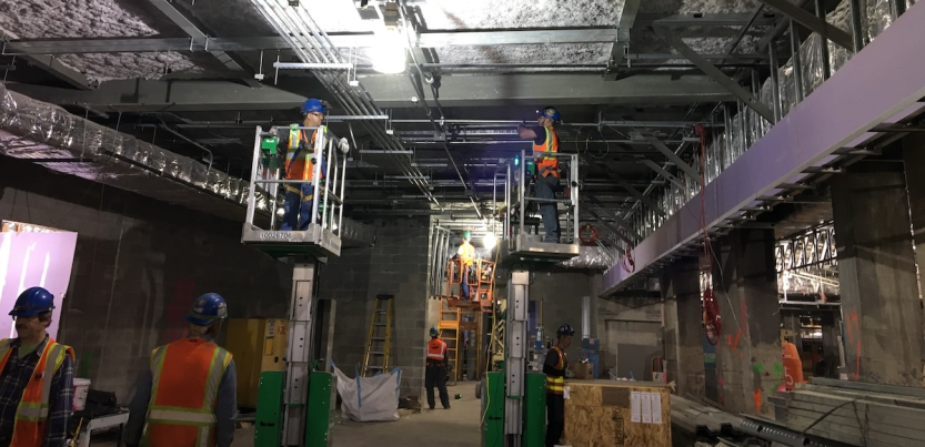 Electrical workers in a tunnel.