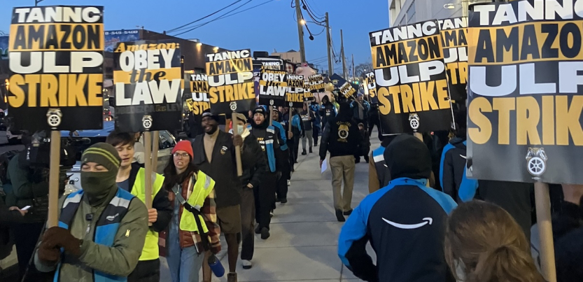 Two lines of striking Amazon workers picket.
