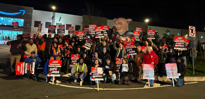 Workers gather holding signs reading: Just Practicing for Safe Jobs, and Just Practicing for Dignity and Respect.