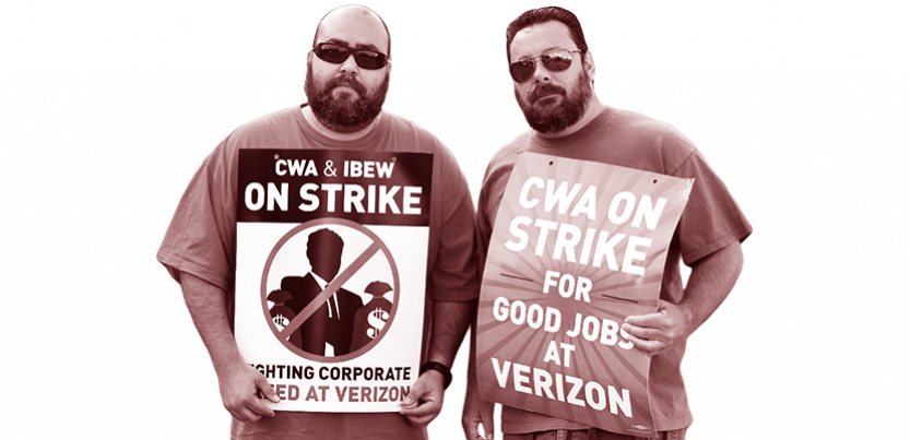 Two workers standing together holding signs.