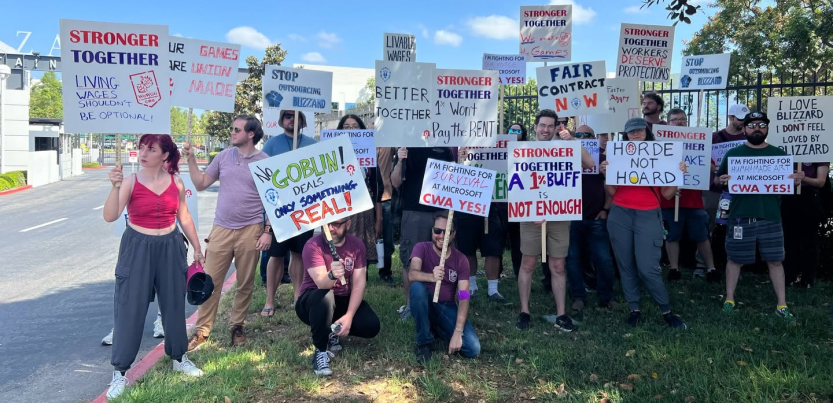 Dozens of Blizzard workers and supporters hold signs outside the Blizzard headquarters in Irvine, California.