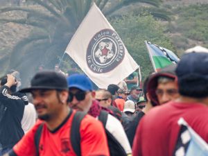 Chilean protesters gathered near a flag.