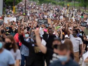 Crowd of protesters protesting George Floyd murder