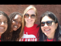 Selfie of four Baltimore teachers in front of a school.