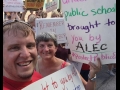 Members of the Maconaquah Education Association hold up signs to support teachers and public education.