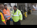 Three workers discussing workplace issues.