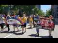 Macy's workers marching for their workplace rights during Seattle's Pride Parade.