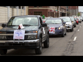 caravan of cars to support USPS in Detroit