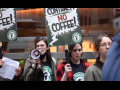 workers march with “no contract, no coffee” signs, one with a megaphone