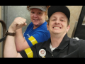 A man and a woman hold up fists