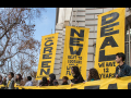 Green New Deal banners at rally