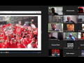 Zoom display shows a photo from Verizon strike (sea of red shirts) on the left; on the right, thumbnails of 18 participants in the call