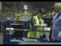 Two workers at work from the documentary American Factory