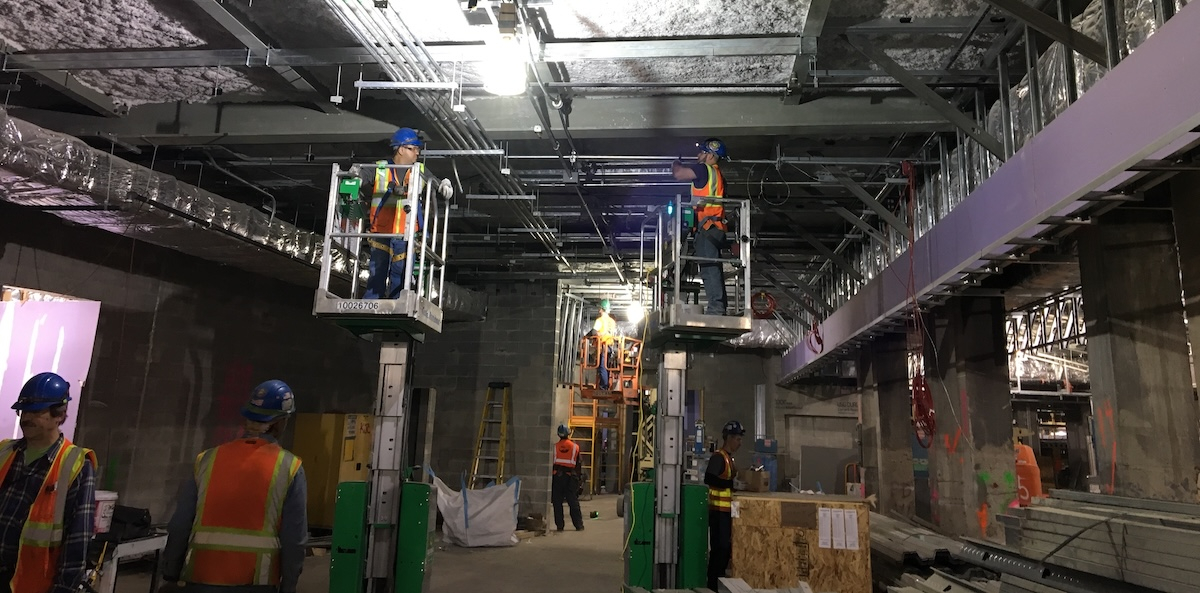 Electrical workers in a tunnel.