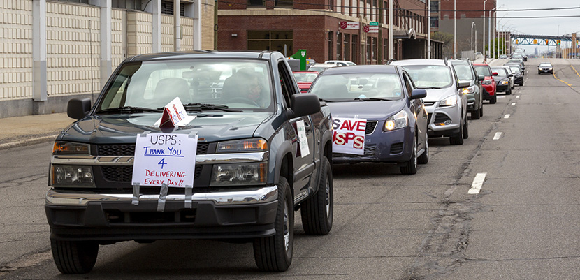 caravan of cars to support USPS in Detroit