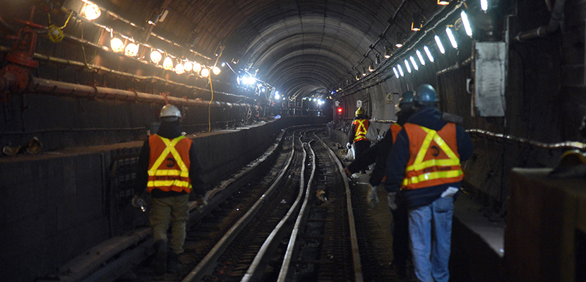New York City transit workers working in a subway tunnel in 2017.