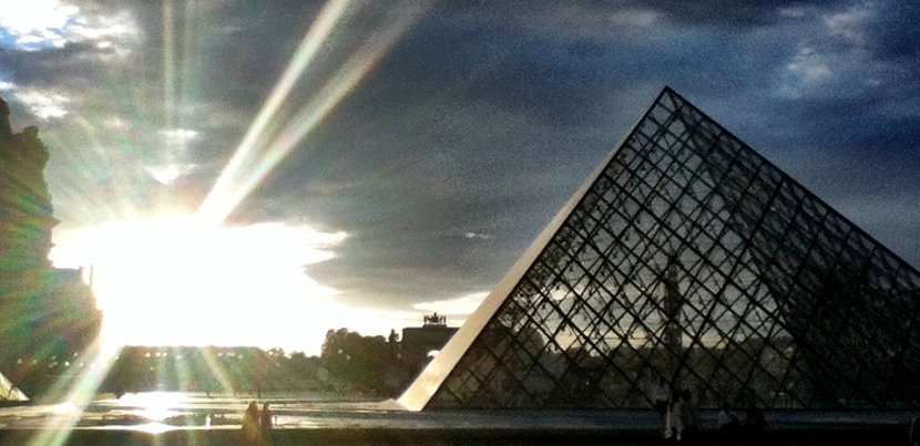 The Louvre's outside pyramid at sunset.