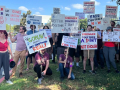 Dozens of Blizzard workers and supporters hold signs outside the Blizzard headquarters in Irvine, California.