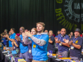 Delegates stand and applaud at the UAW convention.