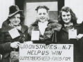 Five women in a black and white photo hold a sign saying “400 on strike since November 7 Our members need funds”